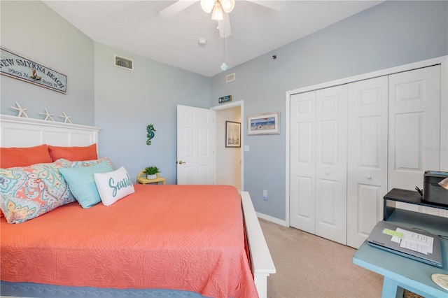 5300 S Atlantic Ave Unit 2-501, New Smyrna Beach, FL 32169 - bedroom with ceiling fan, a closet, light colored carpet, visible vents, and baseboards