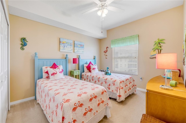 5300 S Atlantic Ave Unit 2-501, New Smyrna Beach, FL 32169 - bedroom featuring light carpet, a closet, ceiling fan, and baseboards