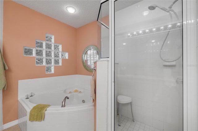 5300 S Atlantic Ave Unit 2-501, New Smyrna Beach, FL 32169 - full bathroom featuring a bath, a stall shower, and a textured ceiling