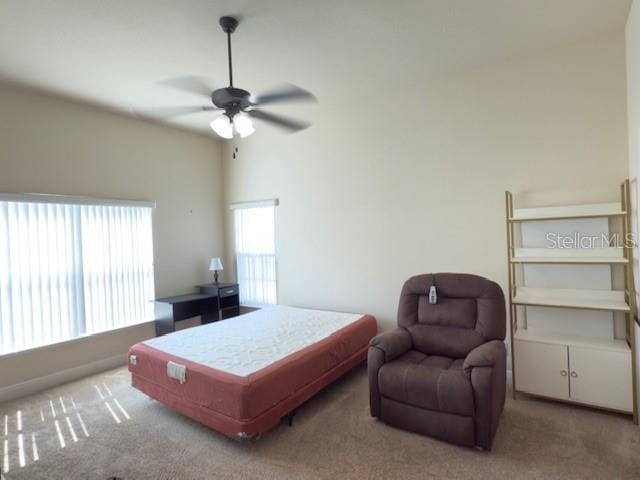 carpeted bedroom with a ceiling fan