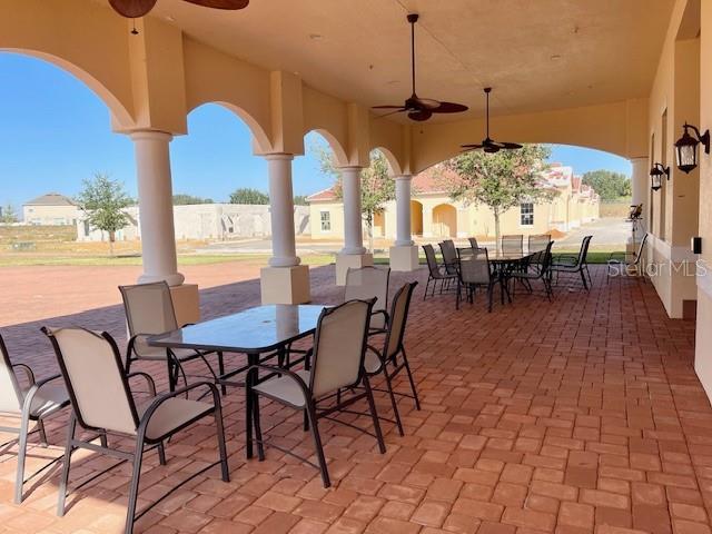 view of patio / terrace featuring ceiling fan and outdoor dining area