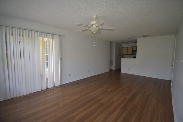 1075 S Hiawassee Rd Unit 916, Orlando, FL 32835 - unfurnished living room with dark wood-style flooring, a textured ceiling, visible vents, and ceiling fan
