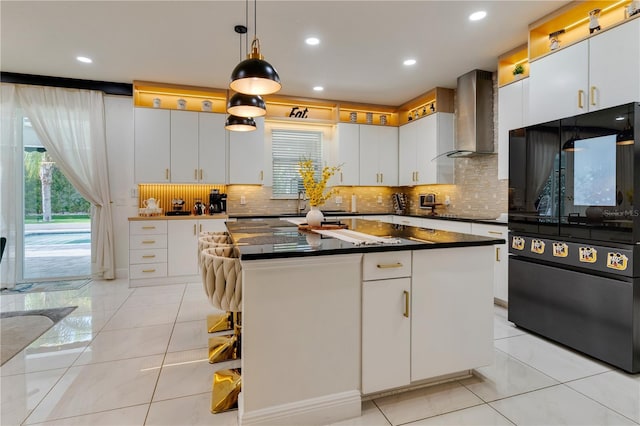 8109 Ludington Cir, Orlando, FL 32836 - kitchen featuring a center island, dark countertops, white cabinets, wall chimney exhaust hood, and black appliances