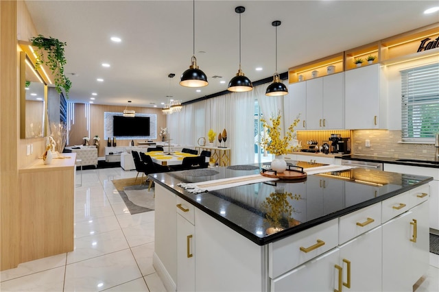 8109 Ludington Cir, Orlando, FL 32836 - kitchen with light tile patterned floors, a center island, dark countertops, recessed lighting, and backsplash
