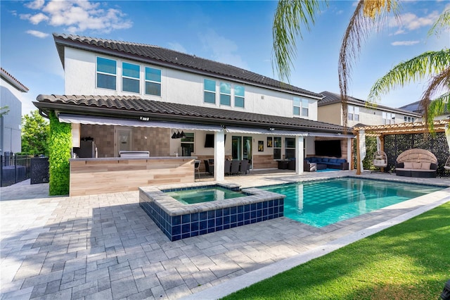8109 Ludington Cir, Orlando, FL 32836 - back of house featuring exterior kitchen, a patio, outdoor dry bar, an outdoor hangout area, and a tile roof