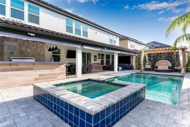 8109 Ludington Cir, Orlando, FL 32836 - rear view of property with a patio, outdoor lounge area, outdoor dry bar, a pergola, and a pool with connected hot tub