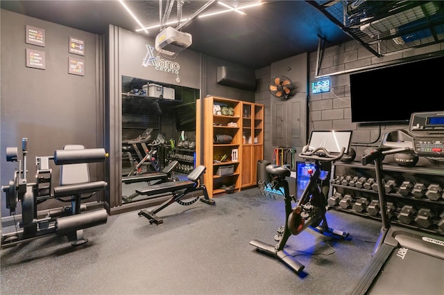 8109 Ludington Cir, Orlando, FL 32836 - workout room with concrete block wall and a wall unit AC