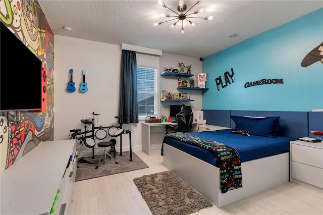 8109 Ludington Cir, Orlando, FL 32836 - bedroom with a chandelier, a textured ceiling, and wood finished floors