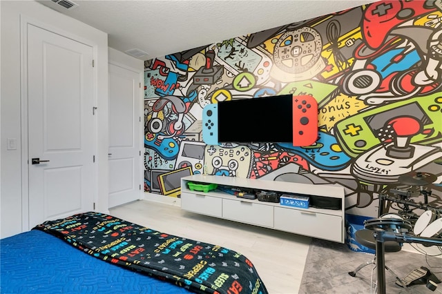 8109 Ludington Cir, Orlando, FL 32836 - bedroom with a textured ceiling, wood finished floors, and visible vents