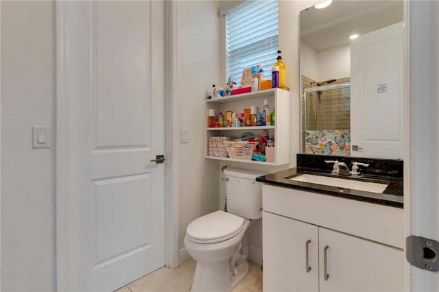 8109 Ludington Cir, Orlando, FL 32836 - bathroom featuring a shower stall, vanity, tile patterned flooring, and toilet