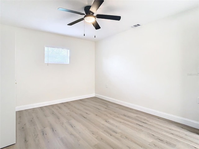 7400 Mitchell Ranch Rd, New Port Richey, FL 34655 - empty room featuring light wood-type flooring, baseboards, and ceiling fan