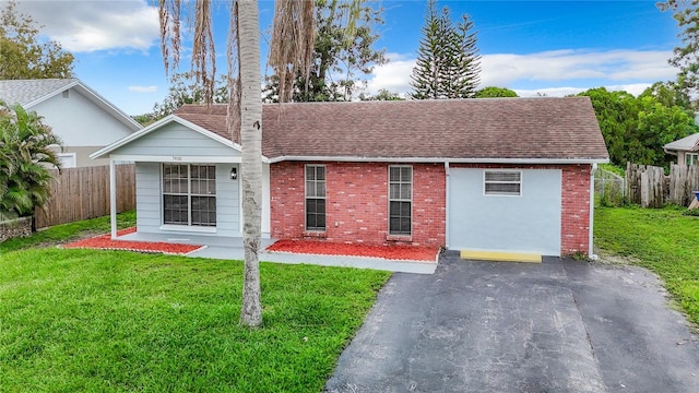 7400 Mitchell Ranch Rd, New Port Richey, FL 34655 - single story home featuring brick siding and roof with shingles
