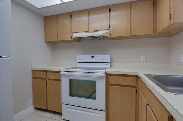 kitchen with a sink, light countertops, under cabinet range hood, white electric range, and light tile patterned flooring