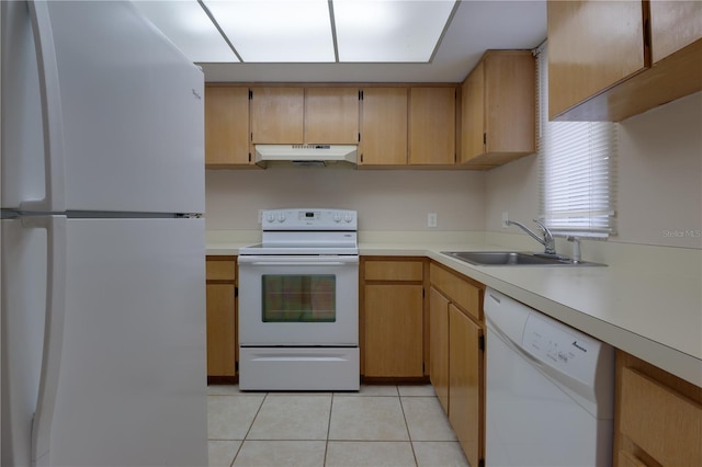 kitchen with a sink, light countertops, white appliances, under cabinet range hood, and light tile patterned flooring