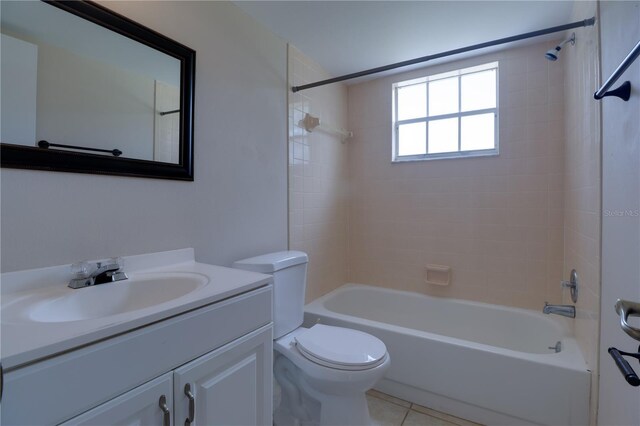 bathroom featuring tile patterned floors, toilet, bathtub / shower combination, and vanity