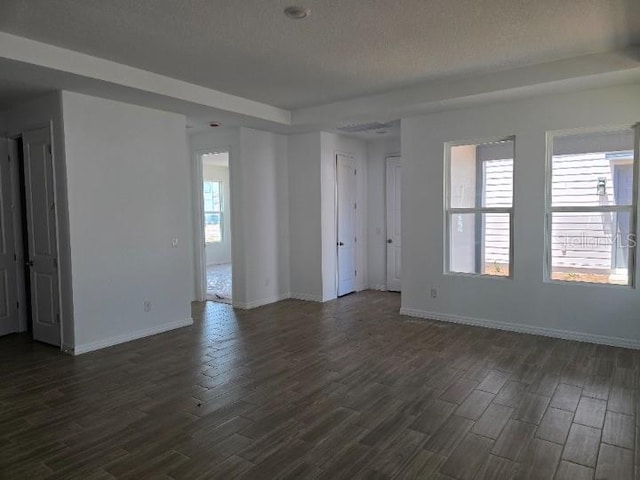 2976 Embark Trl, Saint Cloud, FL 34771 - spare room with dark wood-style flooring and baseboards