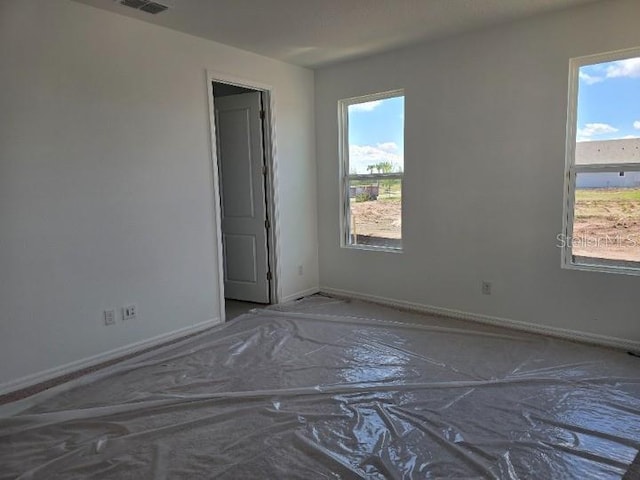 2976 Embark Trl, Saint Cloud, FL 34771 - spare room with healthy amount of natural light and baseboards