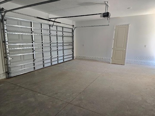 2976 Embark Trl, Saint Cloud, FL 34771 - garage with a garage door opener and baseboards