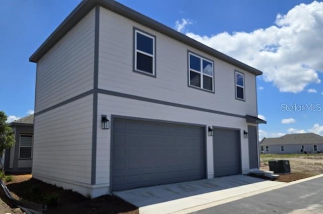 2976 Embark Trl, Saint Cloud, FL 34771 - view of property exterior featuring a garage
