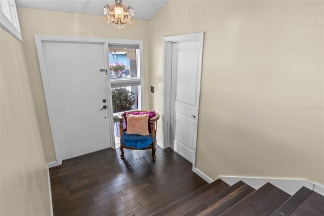 1010 Chokecherry Dr, Winter Springs, FL 32708 - foyer entrance with a chandelier, dark wood-style floors, and lofted ceiling