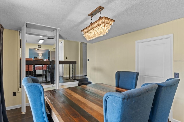1010 Chokecherry Dr, Winter Springs, FL 32708 - dining space featuring dark wood-style flooring and a textured ceiling