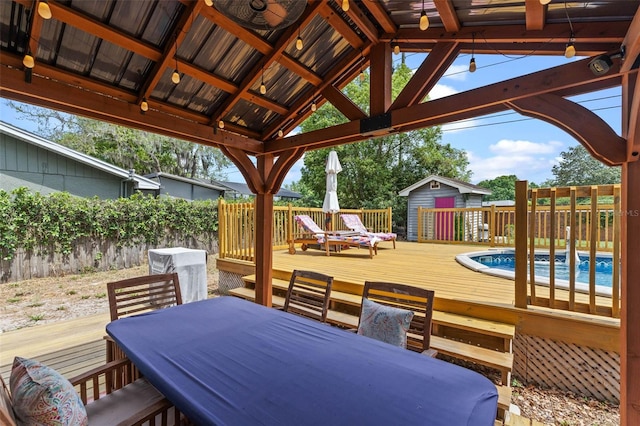 1010 Chokecherry Dr, Winter Springs, FL 32708 - wooden terrace with outdoor dining area and a storage unit