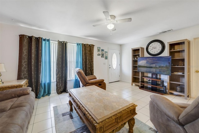 9231 Ventana Ln, Orlando, FL 32825 - living room featuring visible vents, baseboards, light tile patterned flooring, and ceiling fan
