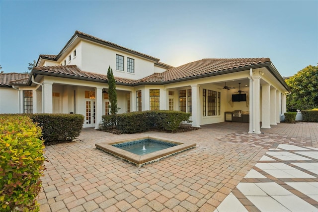 6143 Cartmel Ln, Windermere, FL 34786 - back of property featuring stucco siding, ceiling fan, a tile roof, and french doors