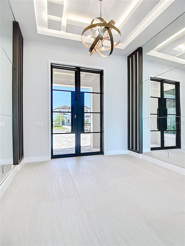 1080 E Jack Nicklaus Ct, Kissimmee, FL 34747 - unfurnished room with french doors, a chandelier, and baseboards