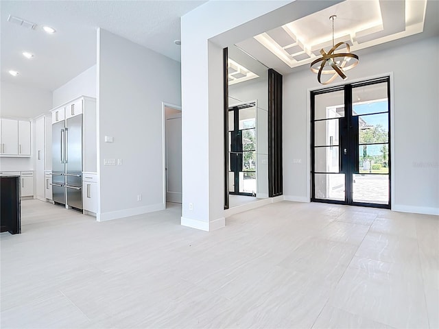 1080 E Jack Nicklaus Ct, Kissimmee, FL 34747 - unfurnished living room with a chandelier, healthy amount of natural light, baseboards, and recessed lighting
