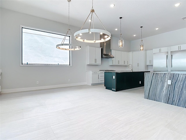 1080 E Jack Nicklaus Ct, Kissimmee, FL 34747 - kitchen featuring built in fridge, a kitchen island with sink, a sink, wall chimney range hood, and recessed lighting