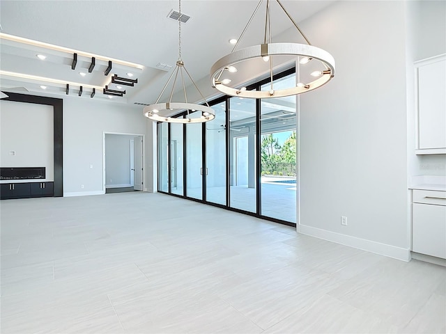 1080 E Jack Nicklaus Ct, Kissimmee, FL 34747 - unfurnished dining area with a chandelier, floor to ceiling windows, baseboards, and recessed lighting
