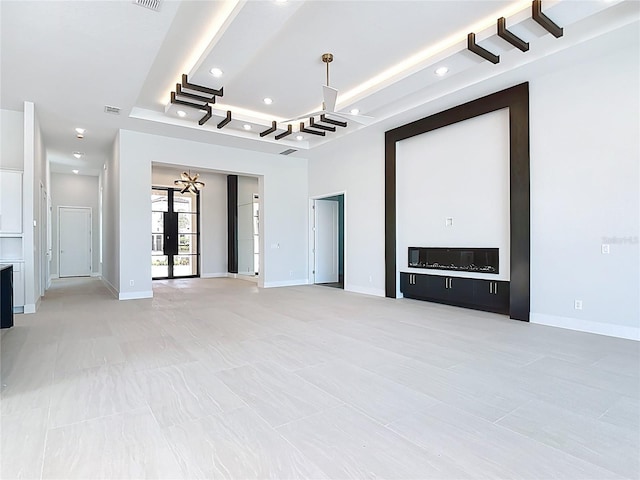 1080 E Jack Nicklaus Ct, Kissimmee, FL 34747 - unfurnished living room with recessed lighting, a raised ceiling, and baseboards