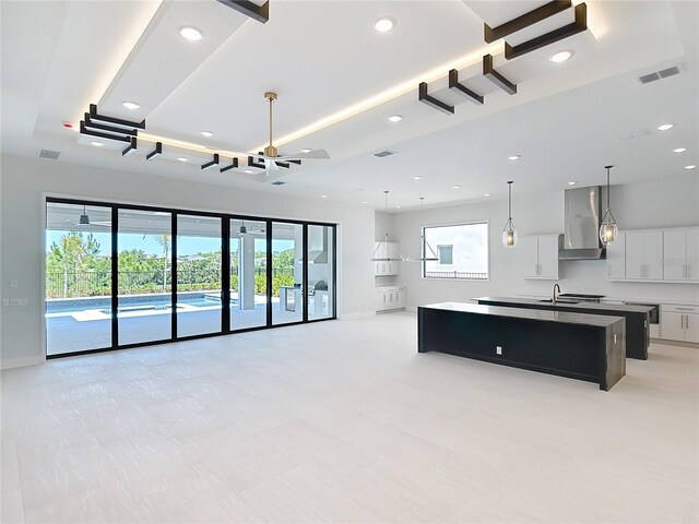 1080 E Jack Nicklaus Ct, Kissimmee, FL 34747 - unfurnished living room with a sink, recessed lighting, and baseboards