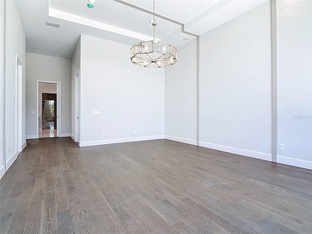 1080 E Jack Nicklaus Ct, Kissimmee, FL 34747 - unfurnished room featuring wood finished floors, a chandelier, and baseboards