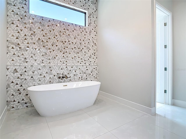 1080 E Jack Nicklaus Ct, Kissimmee, FL 34747 - bathroom featuring a soaking tub and baseboards