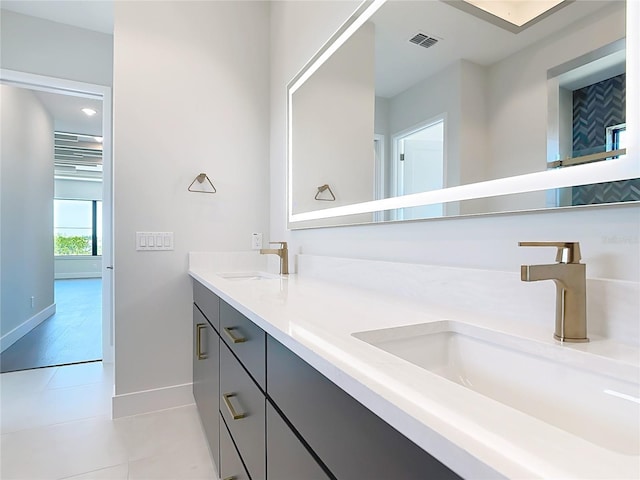 1080 E Jack Nicklaus Ct, Kissimmee, FL 34747 - full bathroom with baseboards, double vanity, and tile patterned floors