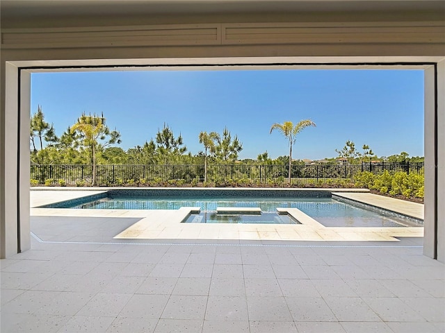 1080 E Jack Nicklaus Ct, Kissimmee, FL 34747 - view of pool featuring fence, a patio area, and a pool with connected hot tub
