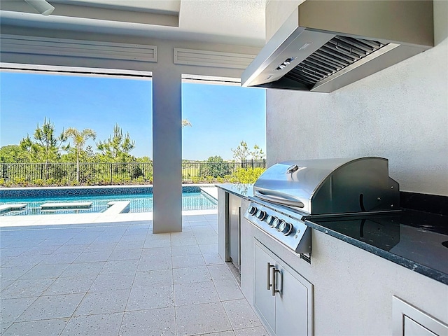 1080 E Jack Nicklaus Ct, Kissimmee, FL 34747 - view of patio with a grill, fence, exterior kitchen, and a pool with connected hot tub
