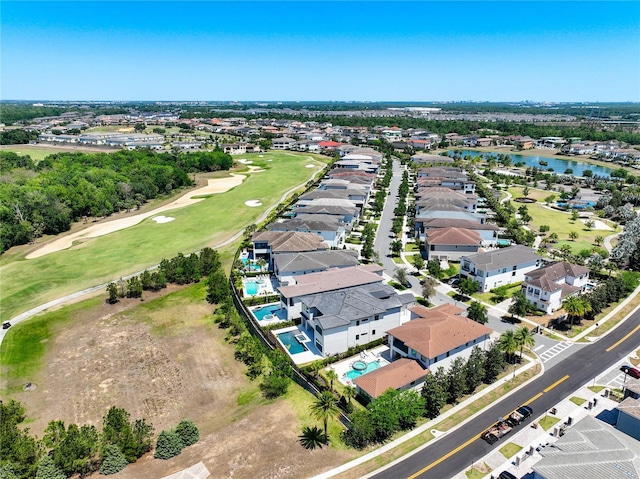 1080 E Jack Nicklaus Ct, Kissimmee, FL 34747 - aerial perspective of suburban area featuring a golf course, a nearby body of water, and a pool