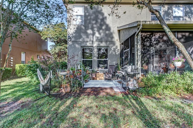 8419 Chamberlain Pl, Oviedo, FL 32765 - back of house featuring a yard and stucco siding