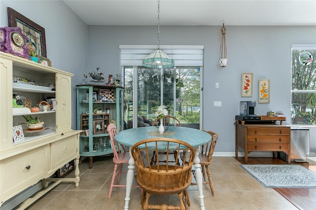 8419 Chamberlain Pl, Oviedo, FL 32765 - dining area featuring light tile patterned flooring