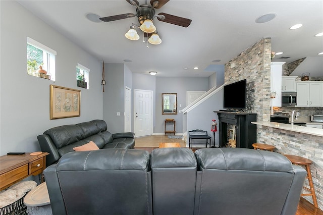 8419 Chamberlain Pl, Oviedo, FL 32765 - living room with a ceiling fan and wood finished floors