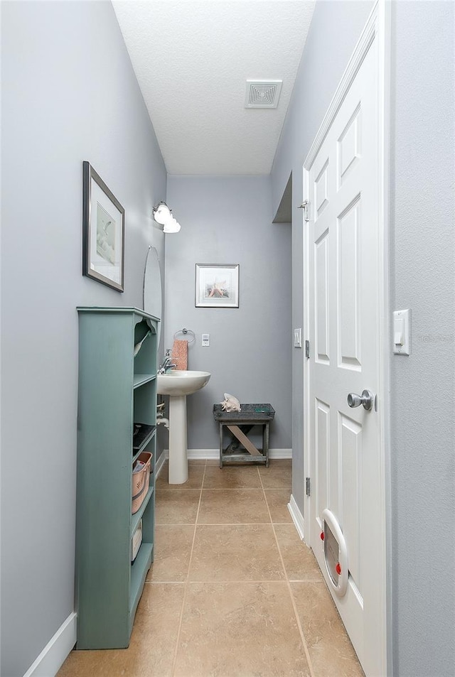 8419 Chamberlain Pl, Oviedo, FL 32765 - bathroom with visible vents, baseboards, and tile patterned floors