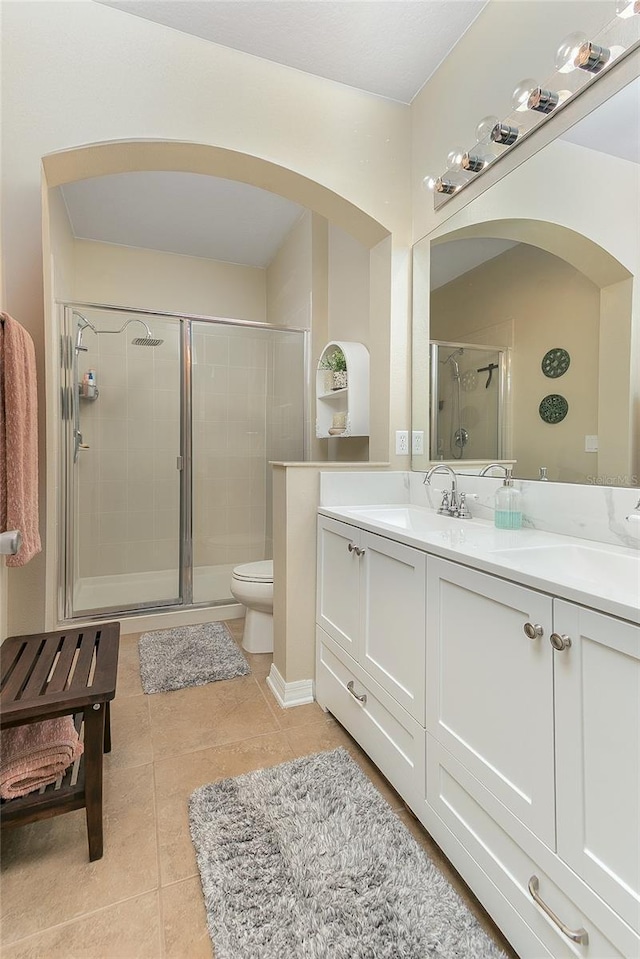 8419 Chamberlain Pl, Oviedo, FL 32765 - full bathroom with a shower stall, tile patterned floors, double vanity, and a sink