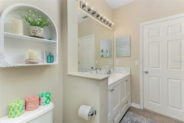 8419 Chamberlain Pl, Oviedo, FL 32765 - bathroom with tile patterned floors, vanity, visible vents, and toilet