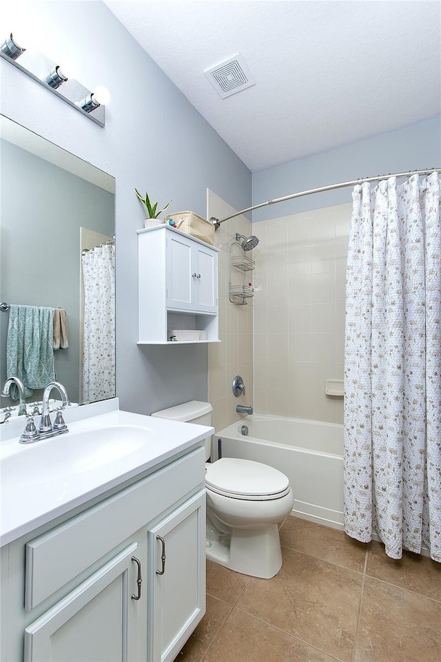 8419 Chamberlain Pl, Oviedo, FL 32765 - bathroom with shower / bath combination with curtain, vanity, tile patterned flooring, visible vents, and toilet