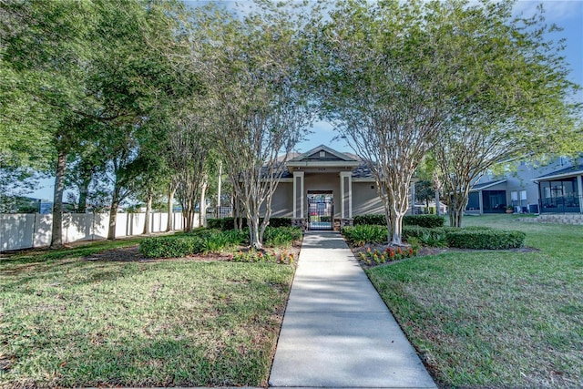 8419 Chamberlain Pl, Oviedo, FL 32765 - view of front of property with a front yard, fence, and stucco siding