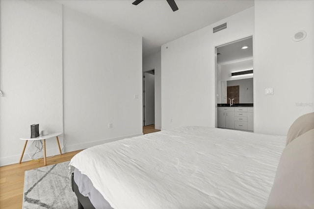 bedroom with wood finished floors and a ceiling fan
