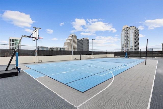 view of sport court with community basketball court and fence